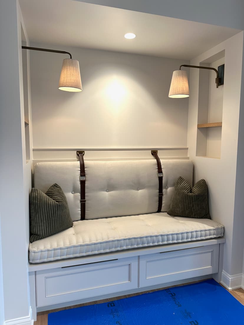 Custom reading nook with french mattress and mounted leather straps.